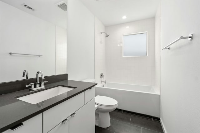 full bathroom featuring vanity, toilet, and tiled shower / bath combo