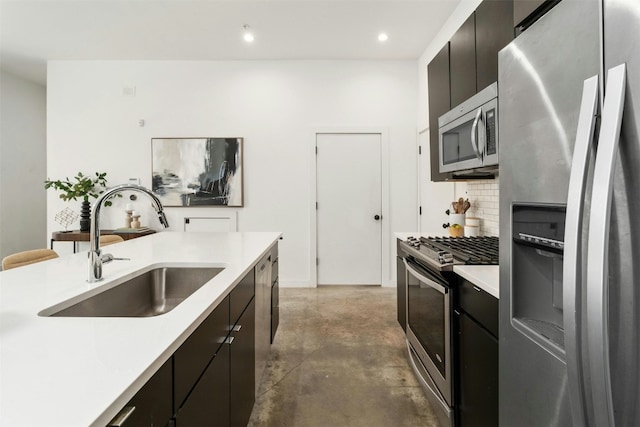 kitchen featuring sink, stainless steel appliances, and backsplash