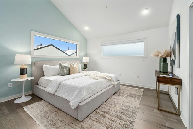 bedroom featuring wood-type flooring and lofted ceiling