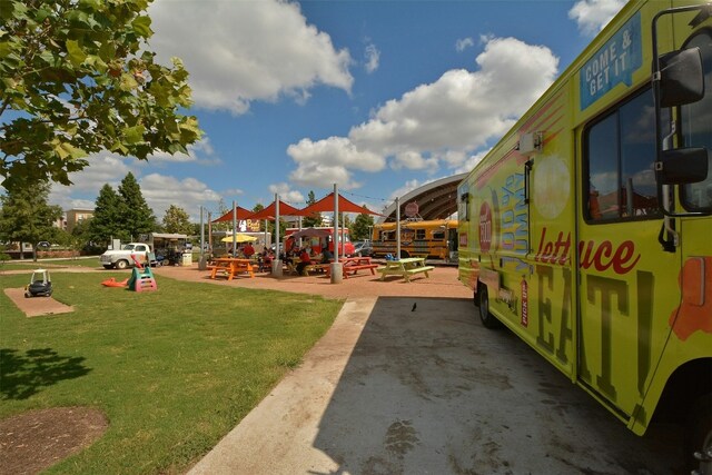 view of play area featuring a lawn