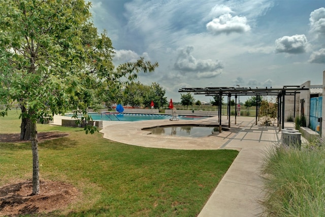 view of pool with a patio, a pergola, and a lawn