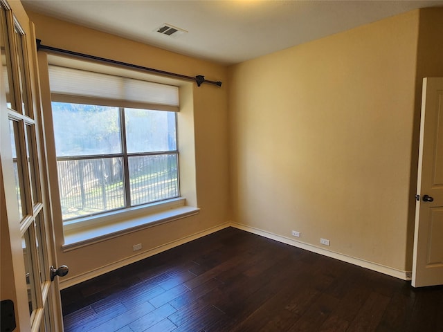 empty room featuring dark hardwood / wood-style floors