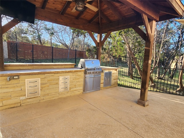 view of patio / terrace with ceiling fan, a gazebo, and area for grilling