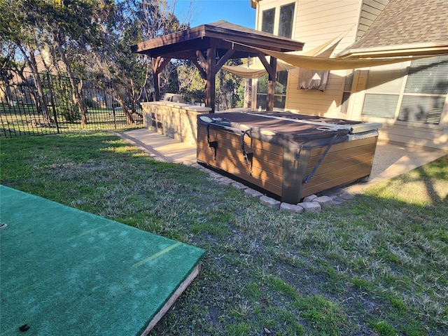 view of yard with a hot tub