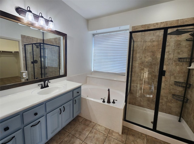 bathroom featuring separate shower and tub, tile patterned floors, and vanity