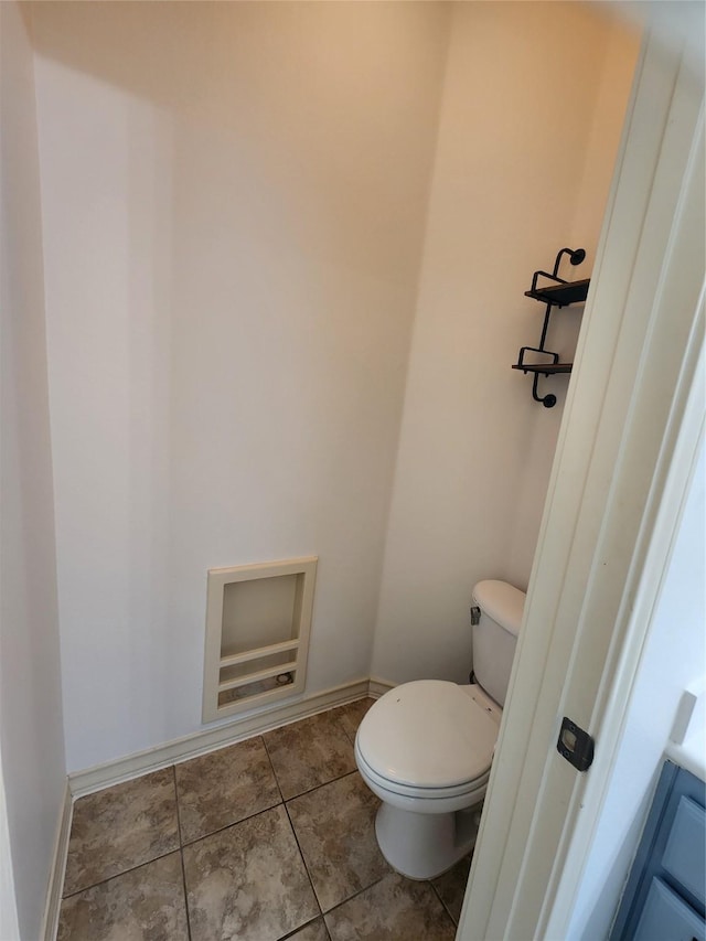 bathroom with tile patterned floors and toilet