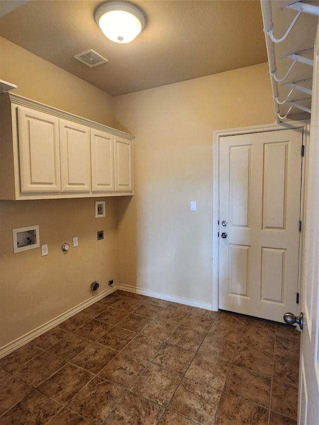 washroom with cabinets, gas dryer hookup, and hookup for a washing machine