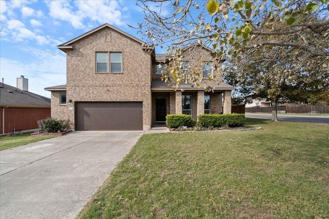 view of front property featuring a garage and a front yard