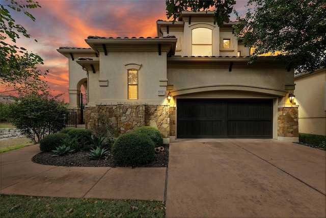 mediterranean / spanish-style house featuring a garage