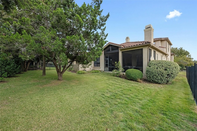 view of yard featuring a sunroom