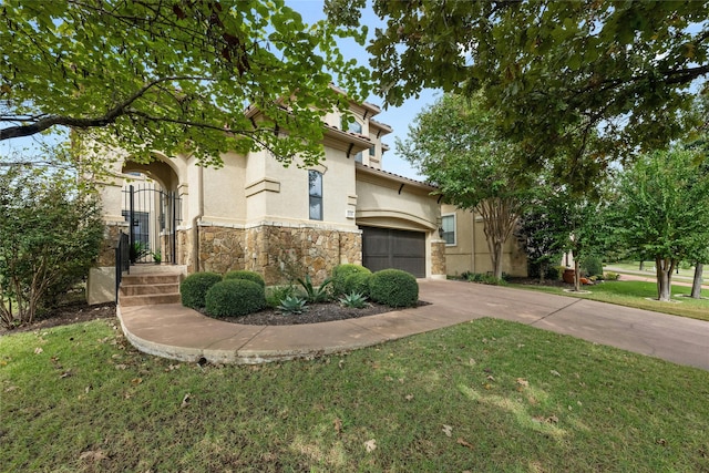 view of front of house with a garage and a front yard