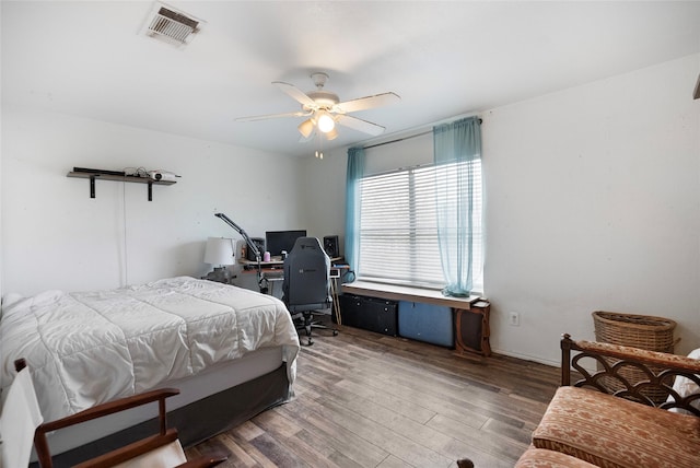 bedroom featuring ceiling fan and dark hardwood / wood-style flooring