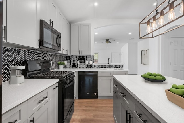 kitchen with black appliances, sink, decorative light fixtures, ceiling fan, and gray cabinets