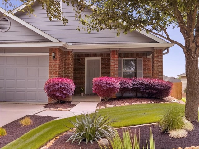 view of front of home featuring brick siding