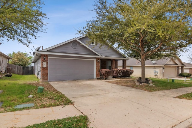 view of front of house featuring a garage and a front lawn