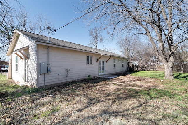 back of house with a yard