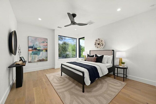 bedroom featuring light wood-type flooring and ceiling fan