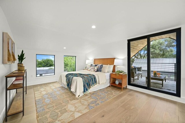 bedroom with light hardwood / wood-style flooring and access to outside