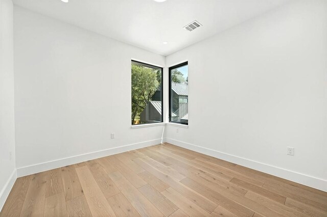 empty room with light wood-type flooring