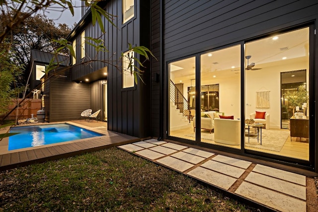 view of pool featuring an outdoor living space, a patio, and ceiling fan