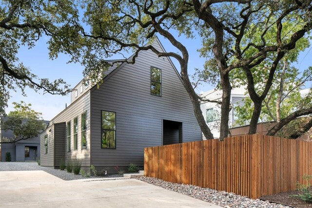 view of side of property with fence