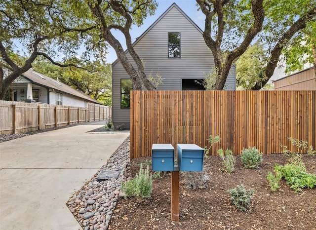 view of side of property featuring a fenced backyard
