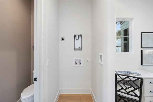 laundry room with hookup for an electric dryer, hardwood / wood-style floors, and washer hookup