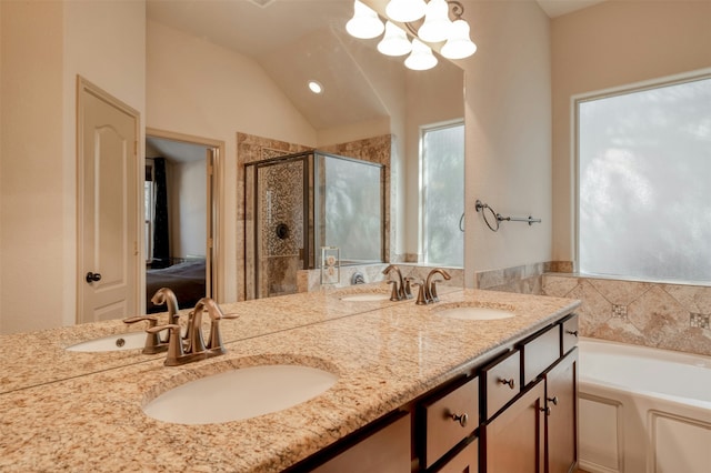 bathroom with a healthy amount of sunlight, vanity, lofted ceiling, and shower with separate bathtub