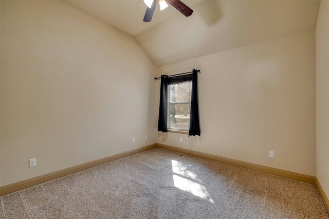 carpeted empty room featuring ceiling fan and lofted ceiling