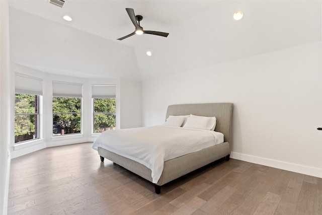 bedroom featuring lofted ceiling, wood-type flooring, and ceiling fan