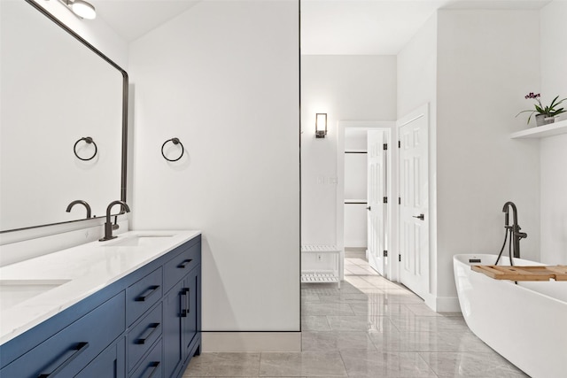 bathroom featuring vanity and a bathtub