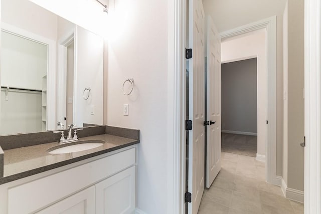 bathroom with vanity and tile patterned flooring