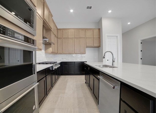17604 Arend Path, Pflugerville, TX 78660 - kitchen with stainless steel appliances, a sink, decorative backsplash, light countertops, and recessed lighting