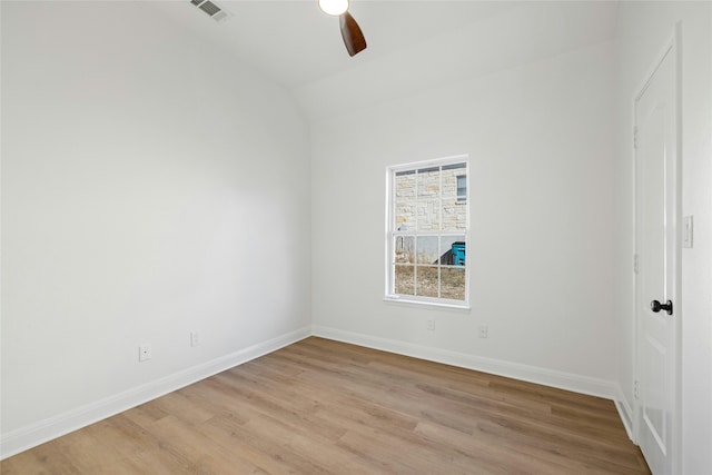 unfurnished room with light hardwood / wood-style flooring, vaulted ceiling, and ceiling fan