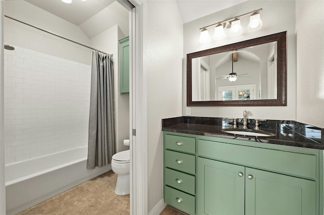 full bathroom with lofted ceiling, vanity, ceiling fan, toilet, and shower / bath combo with shower curtain