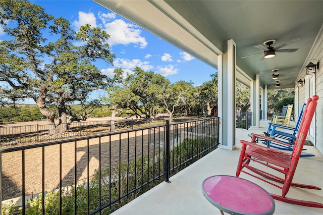 balcony with ceiling fan and a porch