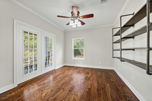 empty room with dark hardwood / wood-style flooring, crown molding, and ceiling fan