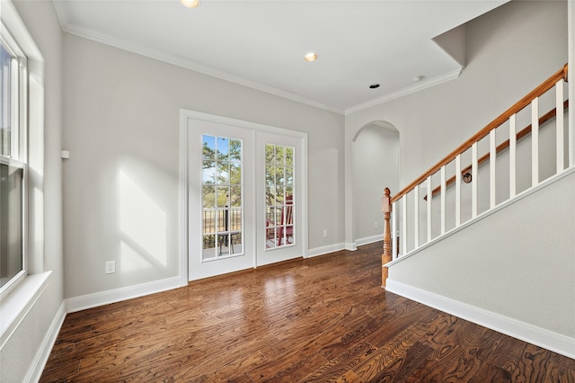 entryway with dark hardwood / wood-style flooring and ornamental molding