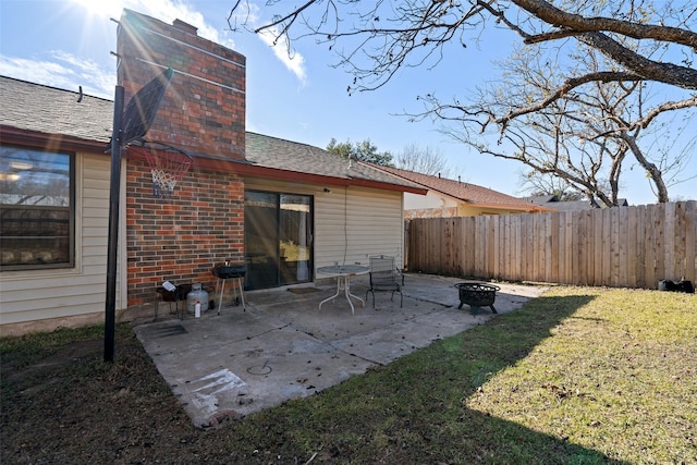 view of patio / terrace featuring an outdoor fire pit