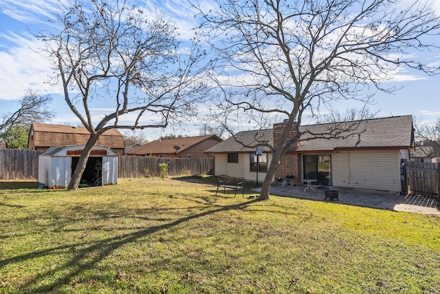 view of yard with a patio and a shed