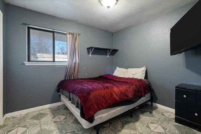 bedroom featuring a textured ceiling