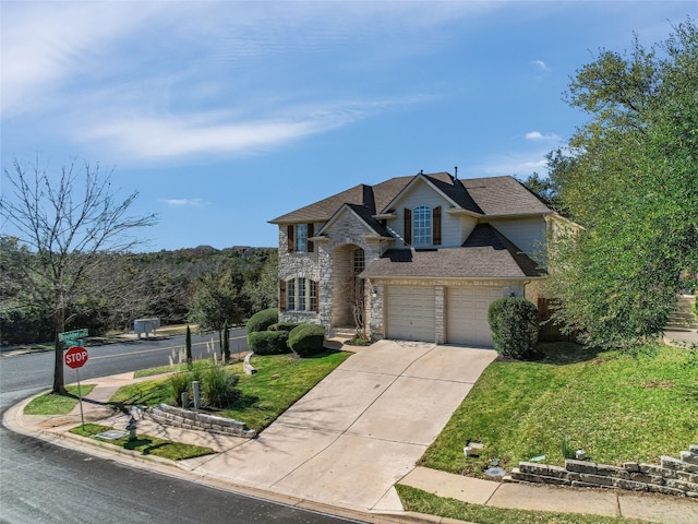 view of front of house with a garage and a front yard