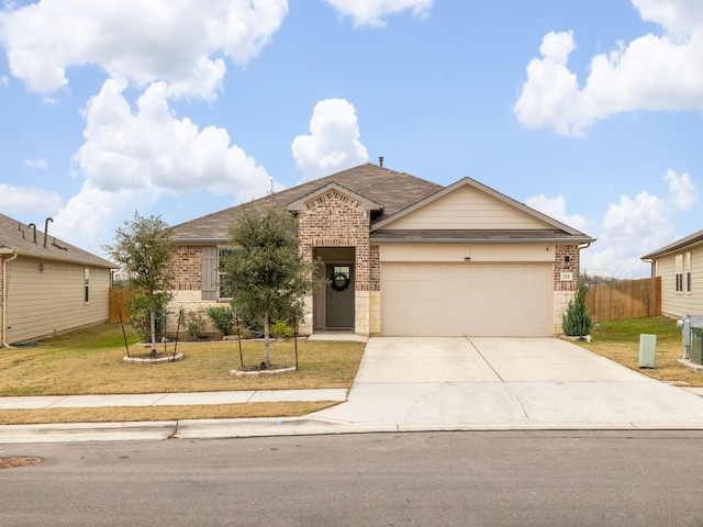 ranch-style home with a garage and a front lawn