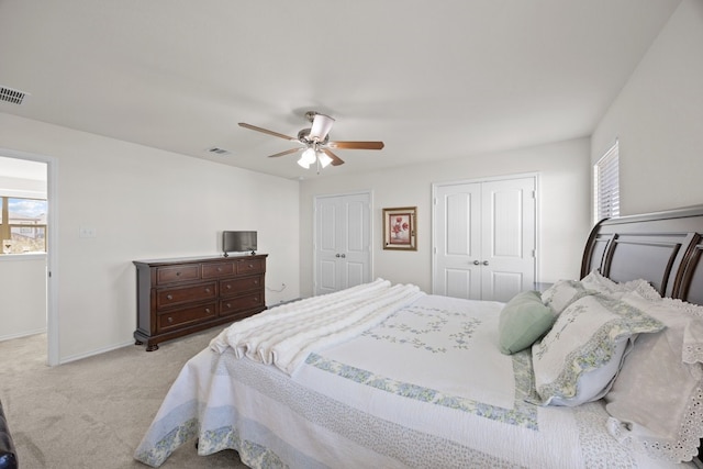 carpeted bedroom with ceiling fan