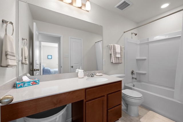 17106 Gibbons Path, Round Rock, TX 78664 - ensuite bathroom featuring toilet, shower / bath combo with shower curtain, vanity, and tile patterned floors