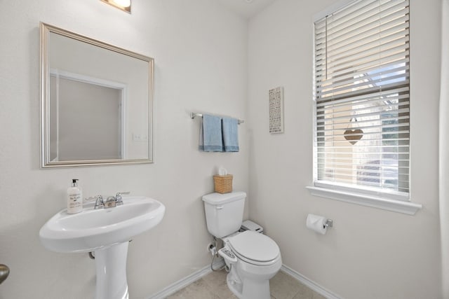 bathroom with tile patterned floors and toilet