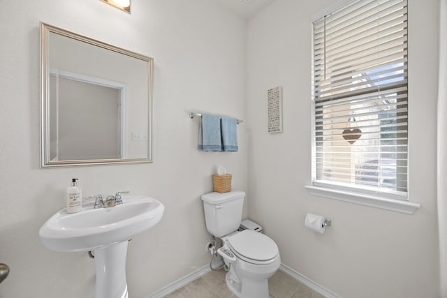 17106 Gibbons Path, Round Rock, TX 78664 - half bathroom featuring baseboards, toilet, and tile patterned floors