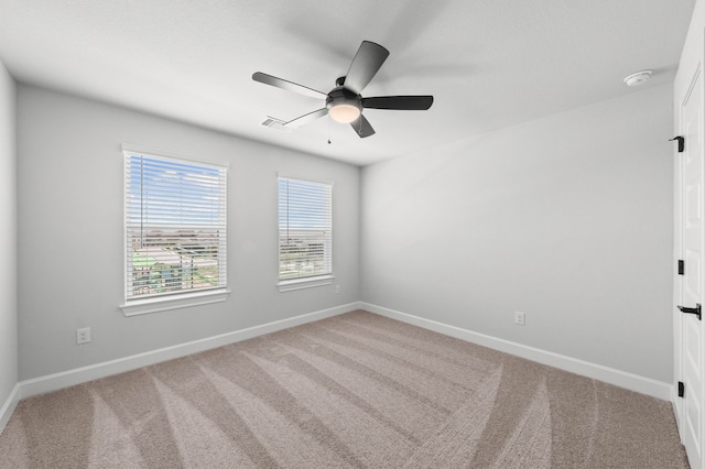 unfurnished room featuring ceiling fan and carpet floors