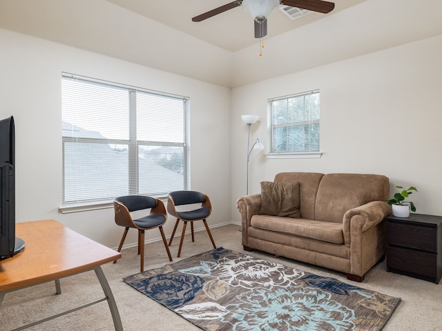 living room with ceiling fan and light colored carpet