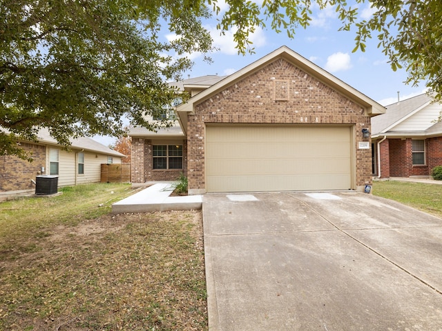 ranch-style house featuring a garage and a front lawn